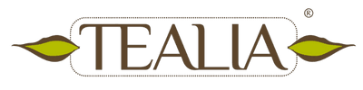 Tealia logo with brown text and yellow leaf graphics on either side, transparent background