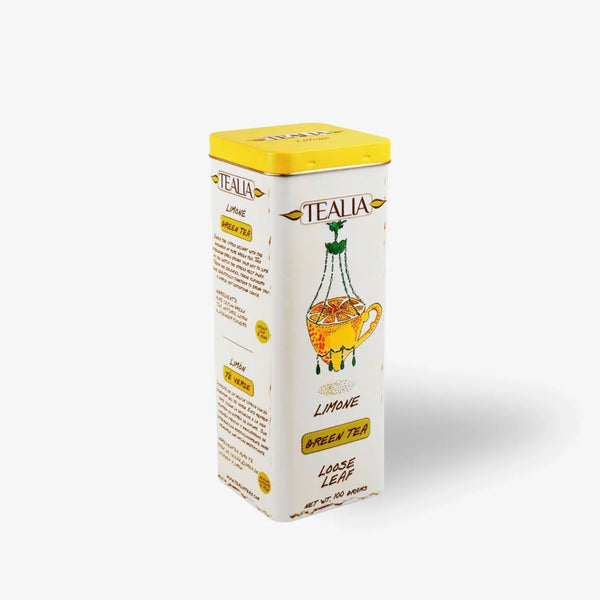 Lemon green tea loose leaf tin with yellow lid and illustrated lemon teacup design