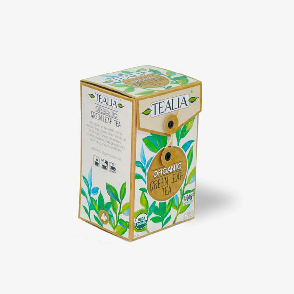 Box of organic green leaf tea with green leaf illustrations on white background