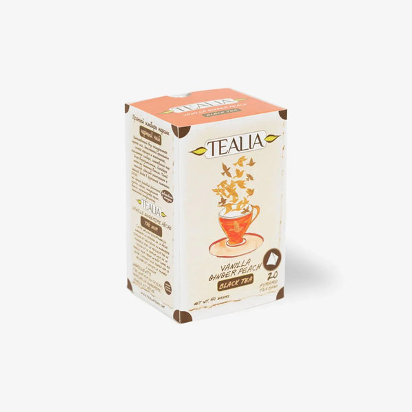 Vanilla ginger peach black tea box with illustrated teacup and butterflies on white background